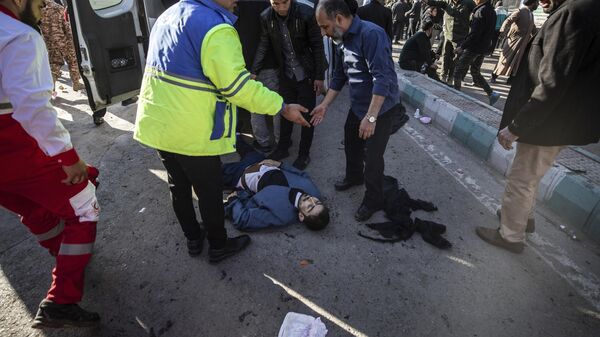 An injured man gets aid after an explosion in Kerman, Iran, Wednesday, Jan. 3, 2024.  - Sputnik Africa