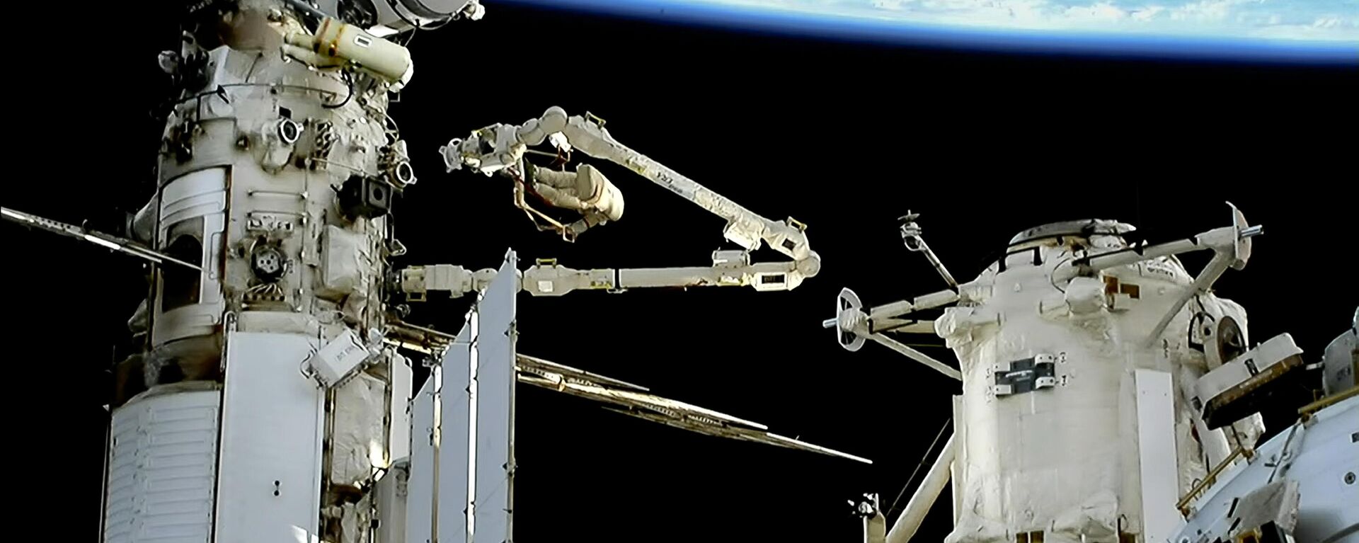In this photo taken from video footage released by Roscosmos State Space Corporation, Roscosmos' cosmonauts Sergey Prokopyev, right on a manipulator, and Dmitri Petelin, left, members of the main crew to the International Space Station are seen during their spacewalk on the International Space Station (ISS), on Wednesday, Aug. 9, 2023. - Sputnik Africa, 1920, 06.04.2024