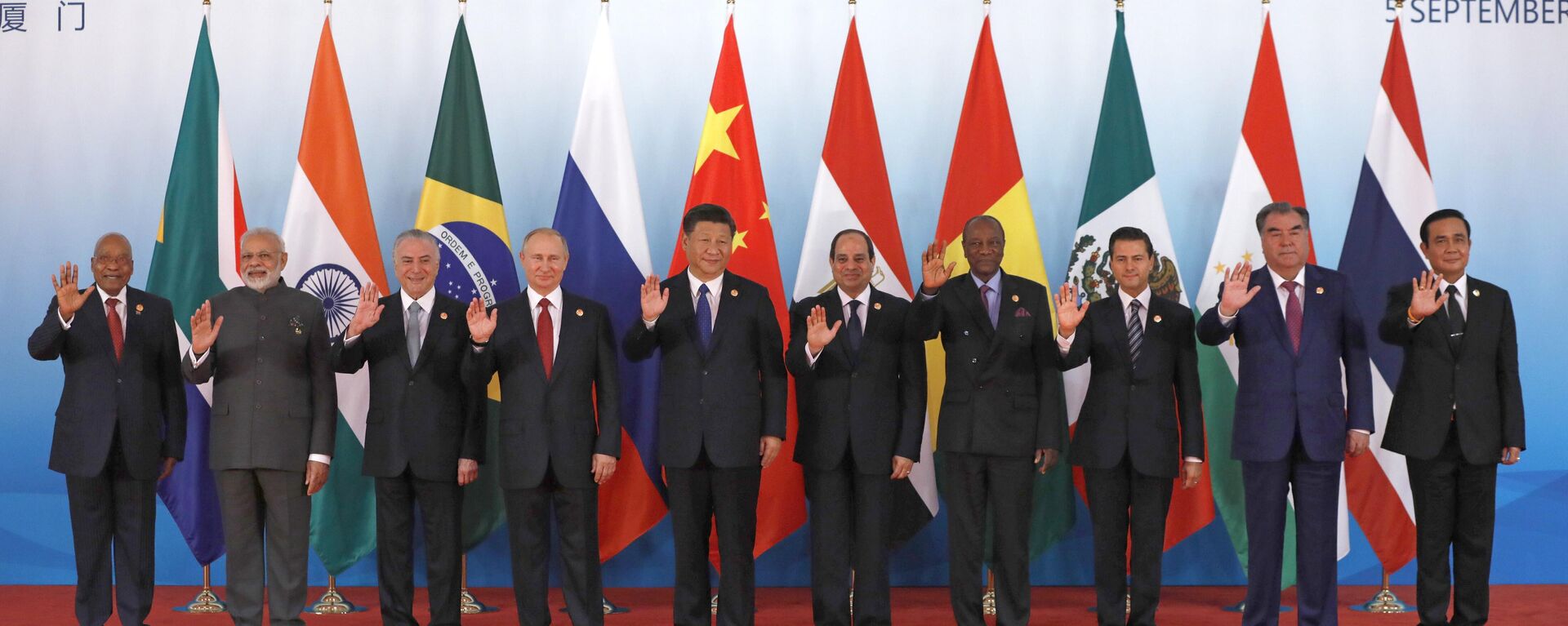 Leaders from left to right, South Africa's President Jacob Zuma, Indian Prime Minister Narendra Modi, Brazilian President Michel Temer, Russian President Vladimir Putin, Chinese President Xi Jinping, Egypt's President Abdel-Fattah el-Sissi, Guinea's President Alpha Conde, Mexico's President Enrique Pena Nieto, Tajikistan's President Emomali Rahmon and Thai Prime Minister Prayuth Chan-ocha pose for group photo ahead of the Emerging Market and Developing Countries meeting at the BRICS Summit, in Xiamen, China, Tuesday, Sept. 5, 2017. - Sputnik Africa, 1920, 22.05.2024