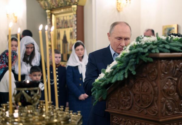 Russian President Vladimir Putin during the Christmas service in the Church of Our Savior Not Made by Hands on the territory of the Novo-Ogaryovo state residence. - Sputnik Africa