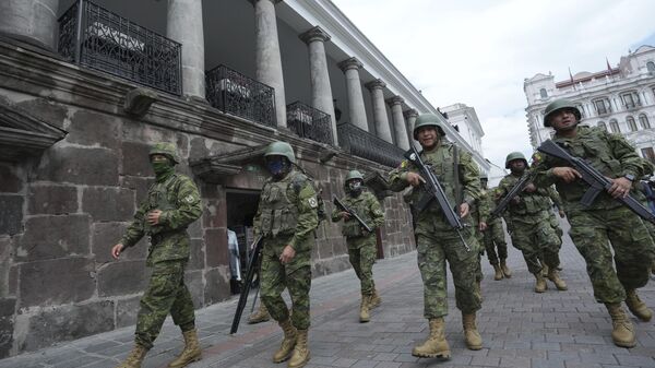 Soldiers patrol outside the government palace during a state of emergency in Quito, Ecuador, Tuesday, Jan. 9, 2024. - Sputnik Africa