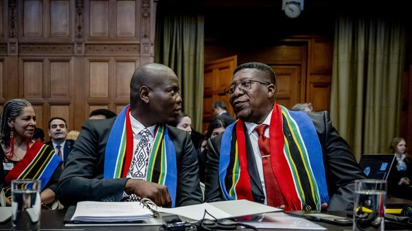 South Africa Minister of Justice Ronald Lamola and South African Ambassador to the Netherlands Vusimuzi Madonsela attend the International Court of Justice (ICJ) ahead of the hearing of the genocide case against Israel brought by South Africa, in The Hague on January 11, 2024. - Sputnik Afrique