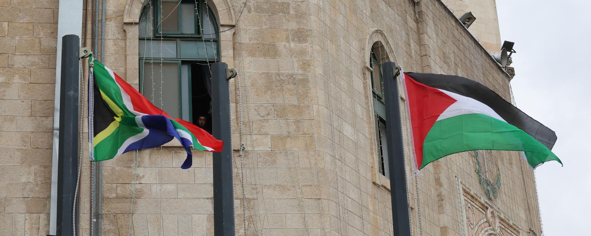 The flags of South Africa and Palestine flutter outside the municipality building in Bethlehem in the occupied West Bank on January 12, 2024, the day after South Africa launched an emergency case at the International Court of Justice (ICJ) arguing that Israel stands in breach of the UN Genocide Convention, signed in 1948 in the wake of the Holocaust.  - Sputnik Africa, 1920, 13.01.2024