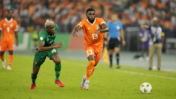 Guinea-Bissau's Jefferson Encada, left, vies for the ball with Ivory Coast's, Jeremie Boga during the African Cup of Nations Group A soccer match between Ivory Coast and Guinea-Bissau at the Stade Olympique Alassane Ouattara B'Ebimpe in Abidjan, Ivory Coast, Saturday, Jan. 13, 2024. - Sputnik Africa