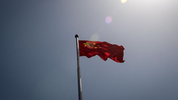 The Chinese national flag is seen at the entrance to the Zhongnanhai leadership compound in Beijing - Sputnik Africa