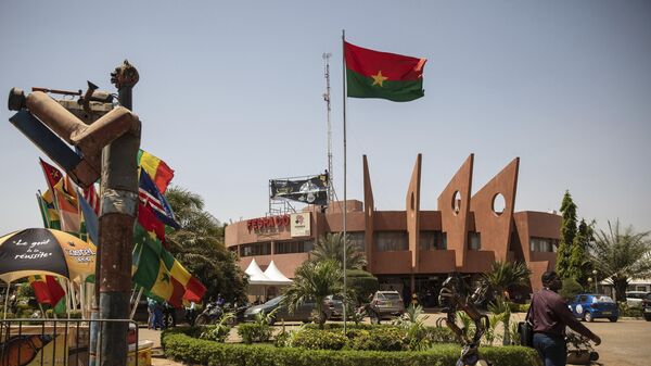 A man walks past the entrance of the headquarters of the FESPACO (Pan-African Film and Television Festival) in Ouagadougou, Burkina Faso, Friday, Feb. 24, 2023.  - Sputnik Afrique
