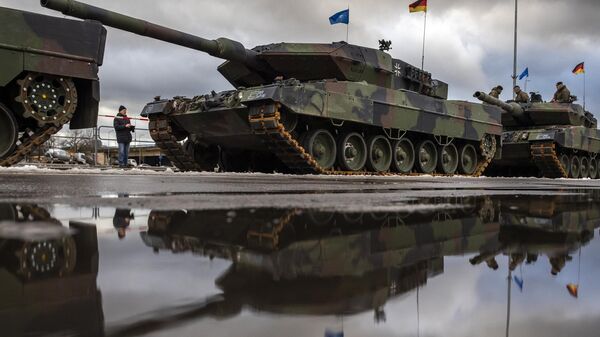 German army main battle tanks Leopard 2A6 are parked prior to the start of a rehearsal for the Armed Forces Day military parade marking the 105th anniversary of the Lithuanian military on Armed Forces Day in Vilnius, Lithuania, Friday, Nov. 24, 2023.  - Sputnik Africa