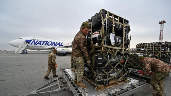 Ukrainian servicemen are at work to receive the delivery of FGM-148 Javelins, American man-portable anti-tank missile provided by US to Ukraine as part of a military support, at Kiev's airport Borispol on February 11, 2022. - Sputnik Africa