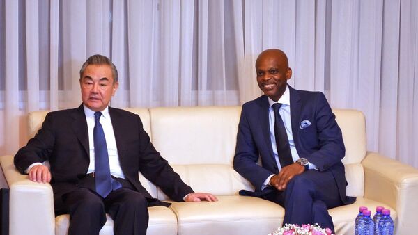 China's Foreign Minister Wang Yi with Togolese Foreign Minister Robert Dussey during Wang's tour to Africa in January 2024. - Sputnik Africa
