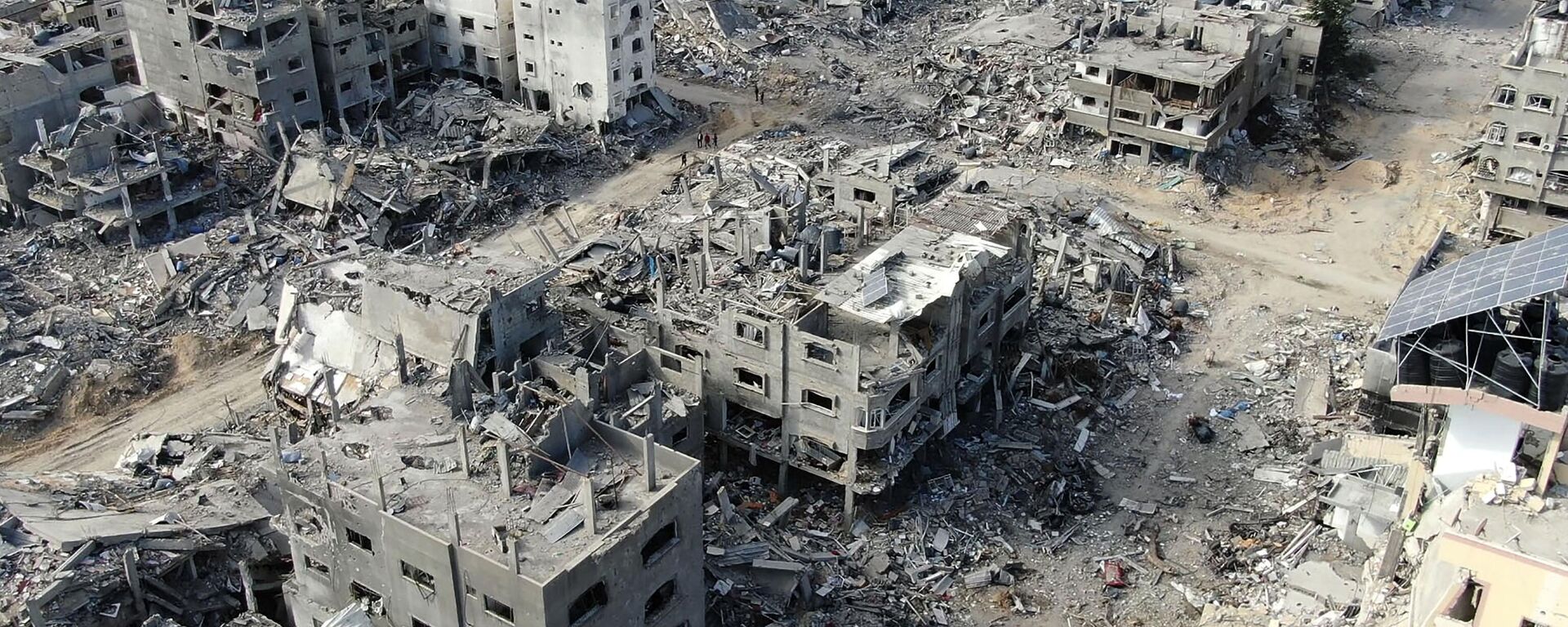 An aerial view on December 26, 2023 shows destroyed buildings in Beit Lahia following Israeli bombardments in the northern Gaza Strip, amid ongoing battles between Israel and the Palestinian militant group Hamas - Sputnik Africa, 1920, 21.01.2024