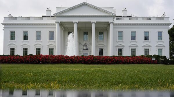 The White House is seen reflected in a puddle, Sept. 3, 2022, in Washington.  - Sputnik Africa