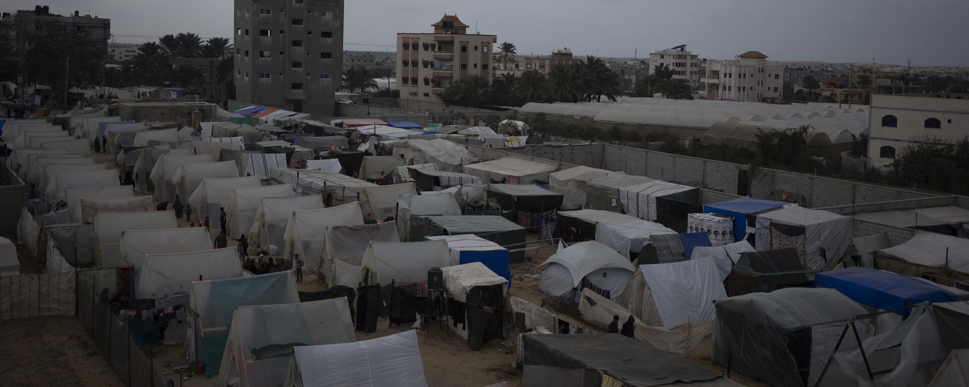 A view of the makeshift tent camp where Palestinians displaced by the Israeli ground offensive on the Gaza Strip are staying, in Rafah, on Tuesday, Jan. 23, 2024. - Sputnik Africa, 1920, 11.02.2024