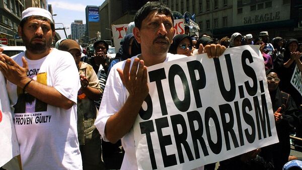 Muslim demonstrators shout anti-US slogans 27 October 2001 outside the US Embassy in Durban to protest against US strikes on Afghanistan. - Sputnik Africa
