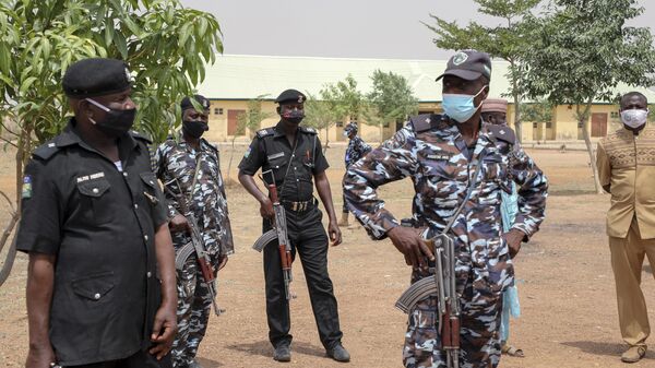 Security forces guard the Government Girls Junior Secondary School where more than 300 girls were abducted by gunmen on Friday, in Jangebe town, Zamfara state, northern Nigeria Sunday, Feb. 28, 2021. - Sputnik Africa