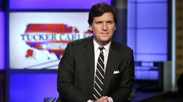 In this March 2, 2017 file photo, Tucker Carlson, host of Tucker Carlson Tonight, poses for photos in a Fox News Channel studio in New York - Sputnik Africa
