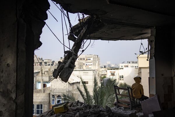 A Palestinian sits in his house destroyed in an Israeli strike in Rafah, Gaza Strip, Saturday, Feb.10, 2024.  - Sputnik Africa