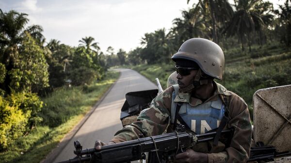 A South African soldier from the United Nations Stabilisation Mission in the Democratic Republic of the Congo (MONUSCO) is seen during a patrol to hold off attacks by the Allied Democratic Front (ADF) rebels on October 08, 2018 in Oicha.  - Sputnik Africa