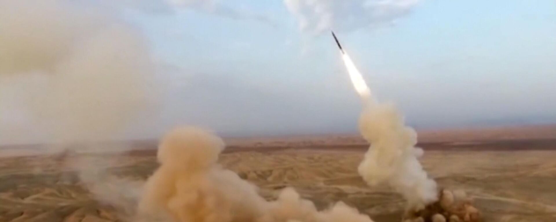 This frame grab from video shows the launching of underground ballistic missiles by the Iranian Revolutionary Guard during a military exercise, July 29, 2020. Iran's paramilitary guard launched underground ballistic missiles as part of an exercise involving a mock-up aircraft carrier in the Strait of Hormuz, state television reported Wednesday - Sputnik Africa, 1920, 17.02.2024