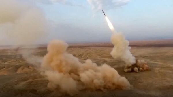This frame grab from video shows the launching of underground ballistic missiles by the Iranian Revolutionary Guard during a military exercise, July 29, 2020. Iran's paramilitary guard launched underground ballistic missiles as part of an exercise involving a mock-up aircraft carrier in the Strait of Hormuz, state television reported Wednesday - Sputnik Africa