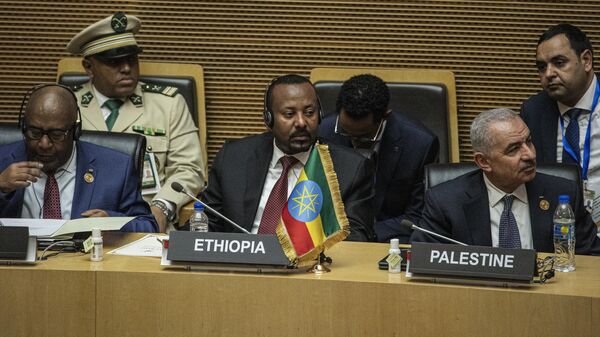Outgoing chairperson of the African Union and President of Comoros Azali Assoumani (L), Prime Minister of Ethiopia Abiy Ahmed (C) and Palestinian Prime Minister Mohammad Shtayyeh (R) attend the opening ceremony of the 37th Ordinary Session of the Assembly of the African Union (AU) at the AU headquarters in Addis Ababa on February 17, 2024.  - Sputnik Africa