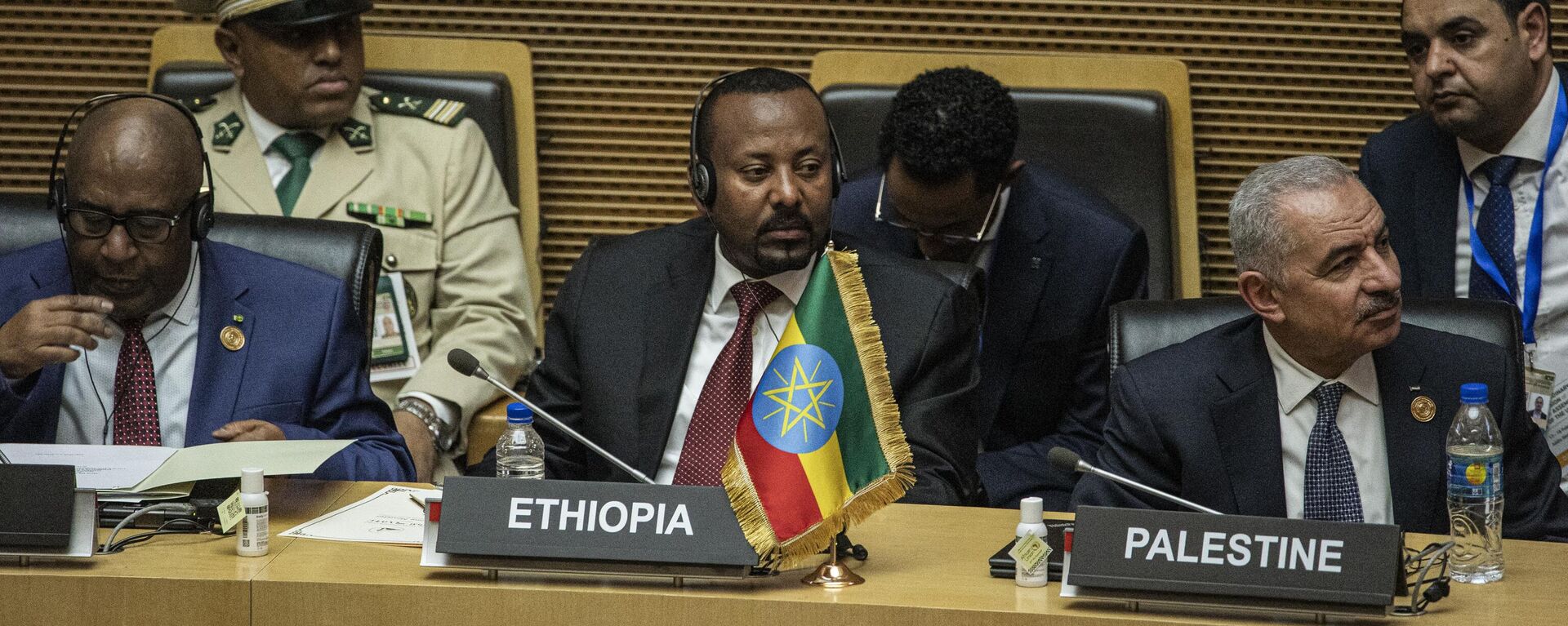 Outgoing chairperson of the African Union and President of Comoros Azali Assoumani (L), Prime Minister of Ethiopia Abiy Ahmed (C) and Palestinian Prime Minister Mohammad Shtayyeh (R) attend the opening ceremony of the 37th Ordinary Session of the Assembly of the African Union (AU) at the AU headquarters in Addis Ababa on February 17, 2024.  - Sputnik Africa, 1920, 17.02.2024