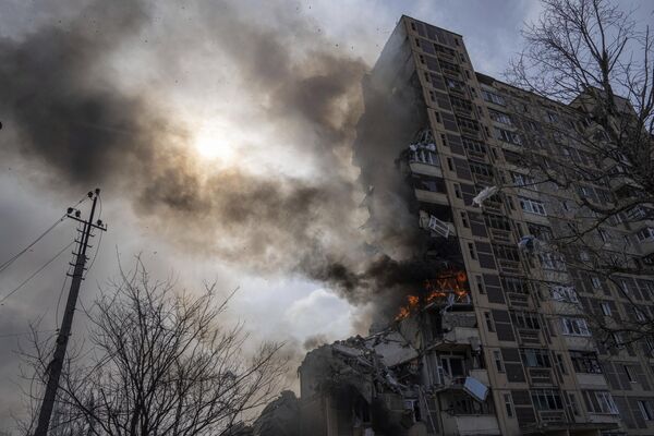 A multi-story building burns in Avdeyevka, Friday, March 17, 2023. - Sputnik Africa