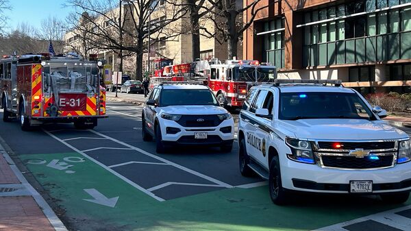 US Secret Service vehicles block access to a street leading to the Embassy of Israel in Washington, DC on February 25, 2024. A man reportedly set  himself on fire near the embassy on Sunday afternoon.  - Sputnik Africa