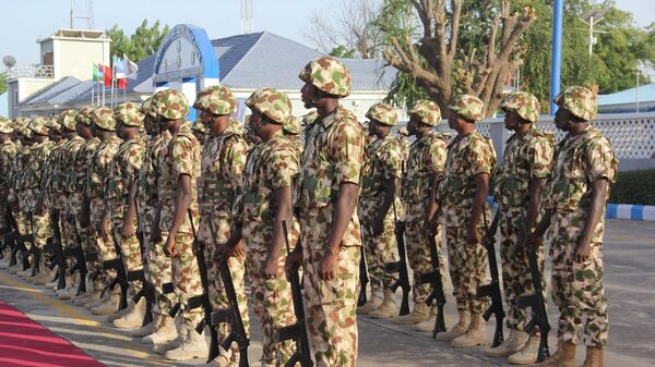 Troops from operation Hadin Kai Maimalari line up at the Air Force Base in Maiduguri on December 11, 2023, during Nigerian President Bola Tinubu visit to the start of the Chief of Army Staff’s (COAS) Annual Conference 2023. - Sputnik Africa
