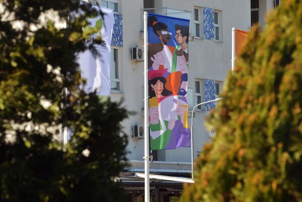 Flags on the facade of an apartment building during preparations for the World Youth Festival. - Sputnik Africa