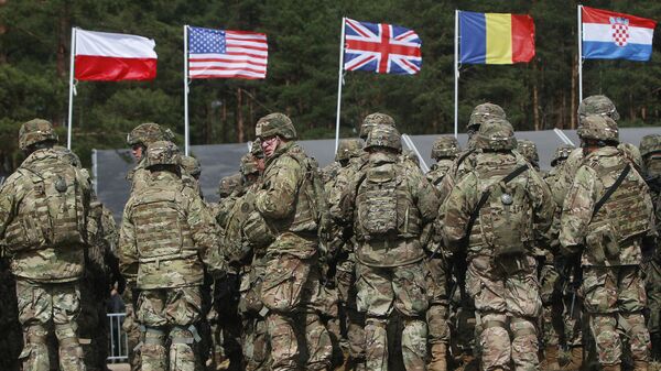 US troops, part of a NATO mission to enhance Poland's defence, are getting ready for an official welcoming ceremony in Orzysz, northeastern Poland, Thursday, April 13, 2017. - Sputnik Africa
