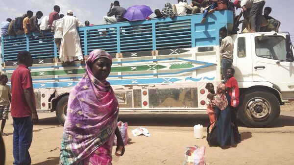 People board a truck as they leave Khartoum, Sudan - Sputnik Africa