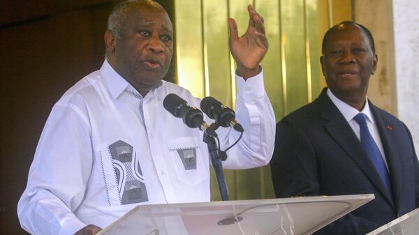Former Ivory Coast President Laurent Gbagbo, left, speaks while meeting Ivory Coast President Alassane Ouattara at the presidential palace in Abidjan Tuesday July 27, 2021. - Sputnik Africa