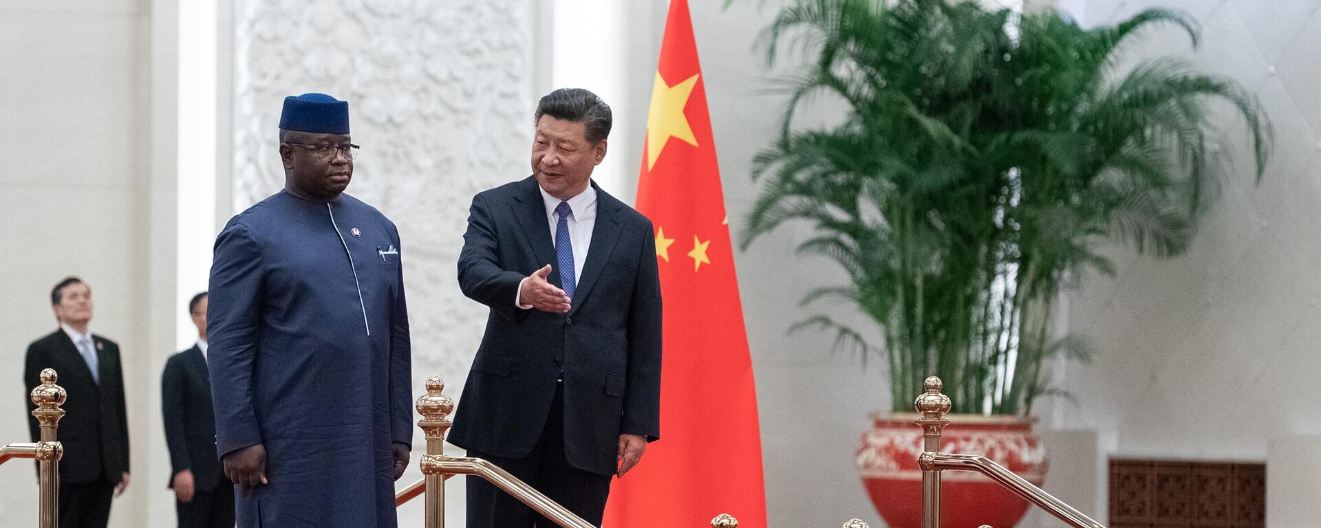 China's President Xi Jinping (R) shows the way to Sierra Leone President Julius Maada Bio (L) during the welcome ceremony at the Great Hall of the People in Beijing on August 30, 2018.  - Sputnik Africa, 1920, 10.03.2024
