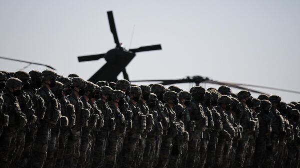 US soldiers line up during the visit of NATO Secretary General Jens Stoltenberg at the Mihail Kogalniceanu airbase, near the Black Sea port city of Constanta, eastern Romania, Friday, Feb. 11, 2022.  - Sputnik Africa