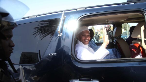 Karim Wade, son of former Senegalese President Abdoulaye Wade, waves as he arrives at the office of the special prosecutor investigating him on charges of embezzled funds, in Dakar, Senegal Friday, March 15, 2013.  - Sputnik Africa
