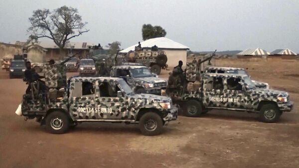 Nigerian Army vehicles are parked at the village were children were kidnapped in Kuriga, Kaduna State - Sputnik Africa