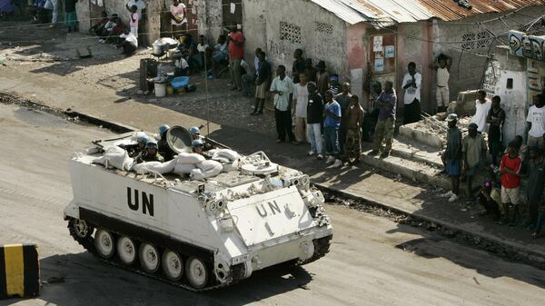 In this Feb. 9, 2007 file photo, a UN armored vehicle patrols the slum of Cite-Soleil in Port-au-Prince.  - Sputnik Africa