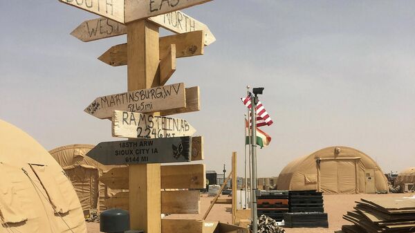 In this photo taken Monday, April 16, 2018, a direction and distance marker at the base camp for air forces and other personnel supporting the construction of Niger Air Base 201in Agadez, Niger.  - Sputnik Africa
