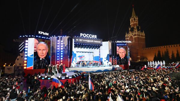 Russian President Vladimir Putin at a concert on Red Square in Moscow, dedicated to the 10th anniversary of Crimea's reunification with Russia.
 - Sputnik Africa