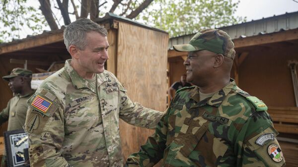 In this photo provided by the U.S. Air Force, US Army Lt. Gen. Jonathan Braga, US Army Special Operations commander, meets with Maj. Gen. Moussa Barmou, Niger Special Operations Forces commander, to discuss anti-terrorism policy and tactics throughout Niger, at Air Base 101, Niger, June 12, 2023.  - Sputnik Africa