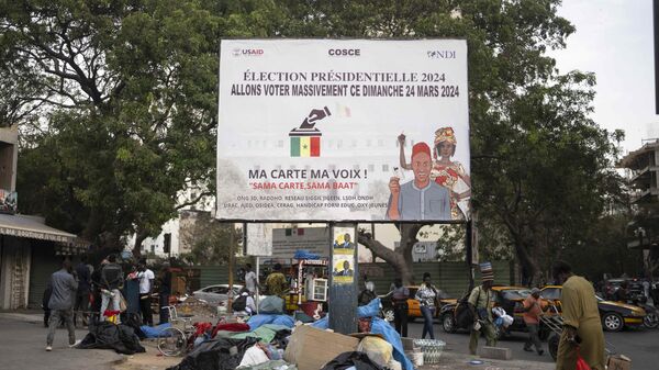 A banner encouraging people to vote in the upcoming presidential elections is displayed in Dakar, Senegal, Wednesday, March 20, 2024.  - Sputnik Africa