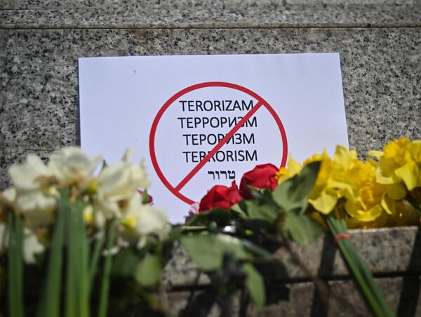 A sign in Belgrade, Serbia which crosses out the word “terrorism” in different languages. - Sputnik Africa