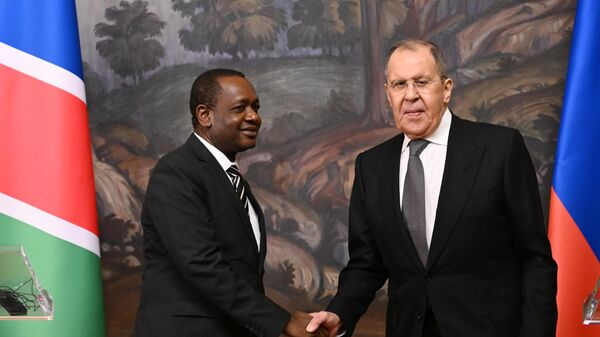 Russian Foreign Minister Sergey Lavrov and Namibian Minister of International Relations, Peya Mushelenga, left, shake hands during a joint press conference following their meeting at the Russian Foreign Ministry's Reception House, in Moscow, Russia, on Tuesday, March 26, 2024. - Sputnik Africa