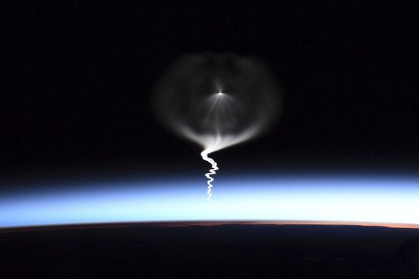 This photo provided by NASA astronaut Christina Koch shows the launch of a Russian Soyuz rocket, as seen from the International Space Station on September 25, 2019. - Sputnik Africa