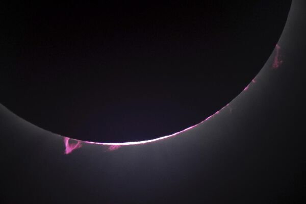 Solar flares and a solar prominence are seen as the moon covers the sun during a total solar eclipse seen from Progressive Field in Cleveland. - Sputnik Africa