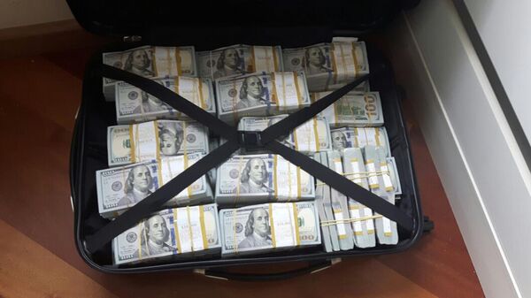 This July 1, 2017 photo released by the Brazilian Federal Police shows a suitcase of money they announced were seized during the arrest of drug lord Luiz Carlos da Rocha in Mato Grosso state, Brazil.  - Sputnik Africa