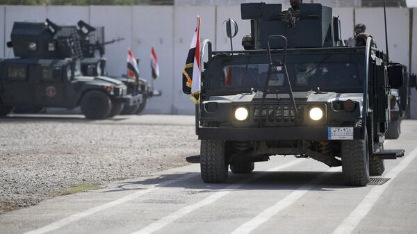 Des membres de la Force d'intervention rapide irakienne participent à un défilé lors d'une cérémonie de remise des diplômes dans une base militaire de la capitale Bagdad, le 4 juillet 2022 - Sputnik Afrique