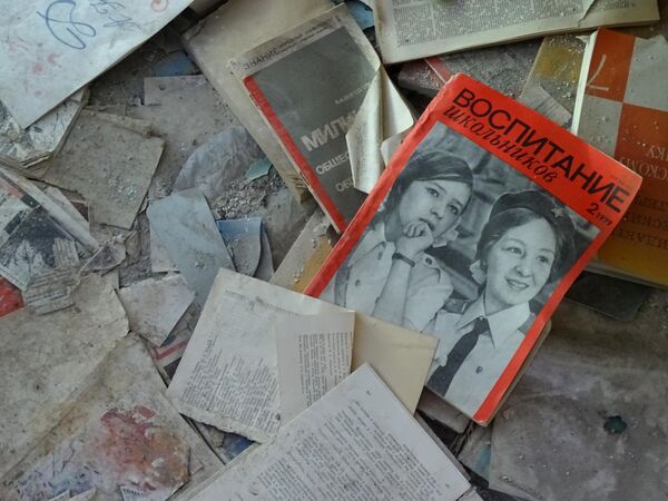 Detail of Littered Magazines and Lessons in an abandoned schoolhouse in Pripyat, Chernobyl Exclusion Zone - Northern Ukraine - Sputnik Africa