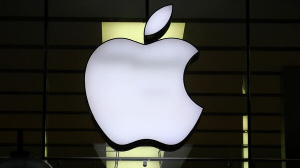 The logo of Apple is illuminated at a store in the city center in Munich, Germany. Dec. 16, 2020 file photo. - Sputnik Africa