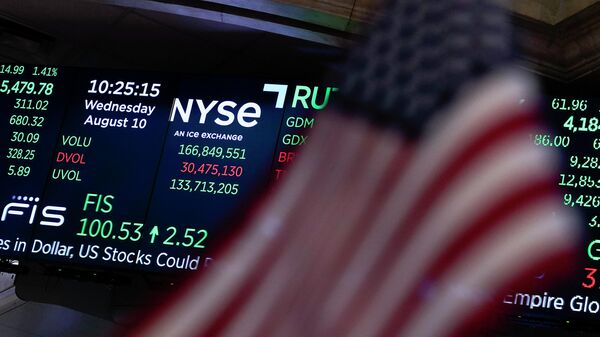 FILE - A screen displays market data at the New York Stock Exchange in New York, Wednesday, Aug. 10, 2022. Wall Street’s big gains this summer have been spread widely across industries. The profit growth underpinning those gains? Not so much. (AP Photo/Seth Wenig, File) - Sputnik Africa